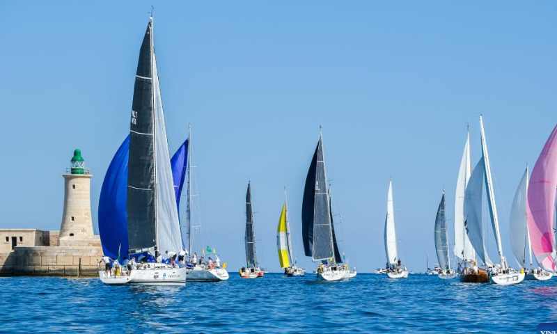 Sailing boats start from Valletta Grand Harbour during the 2022 Rolex Middle Sea Race (43rd edition) in Valletta, capital of Malta, Oct. 22, 2022. Photo: Xinhua