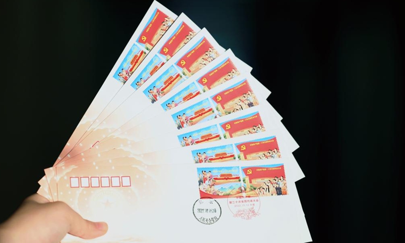 This photo taken on Oct. 16, 2022 shows the first day covers with stamps marking the 20th National Congress of the Communist Party of China (CPC).Photo:Xinhua