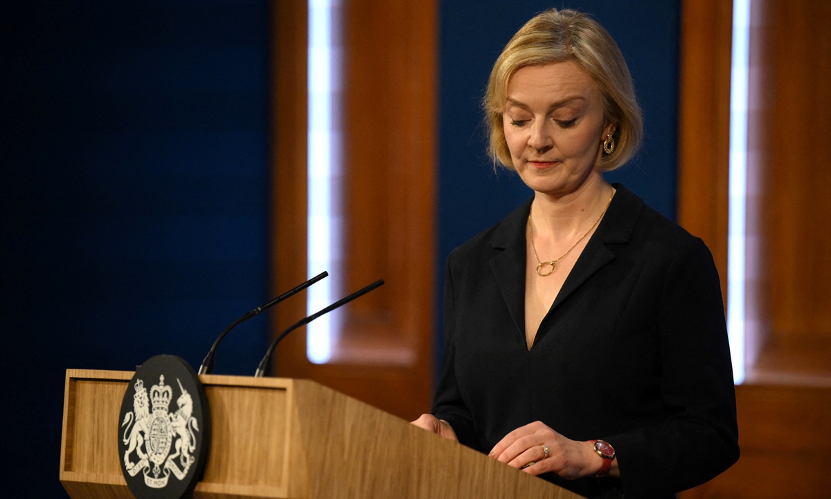 Britain's Prime Minister Liz Truss looks down during a press conference in the Downing Street Briefing Room in central London on October 14, 2022. Photo:AFP