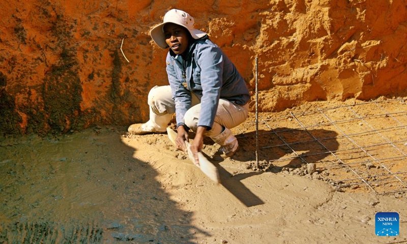 Atamelang Matale works in a biogas digester pit at Betesankwe Village in the Southern District, Botswana, on Sept. 2, 2022.(Photo: Xinhua)