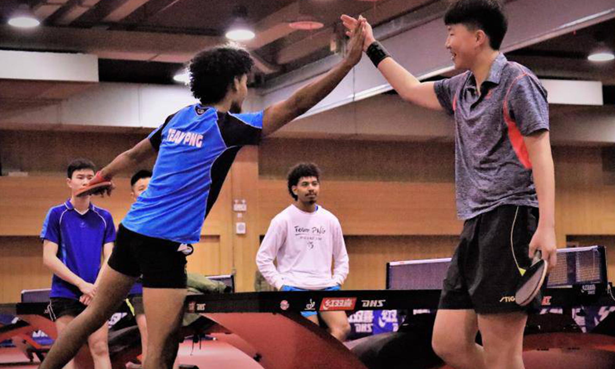 File photo: Geoffrey Loi (center) trains at the Chinese Table Tennis College of Shanghai University of Sport in 2019. Photo: Courtesy of Loi