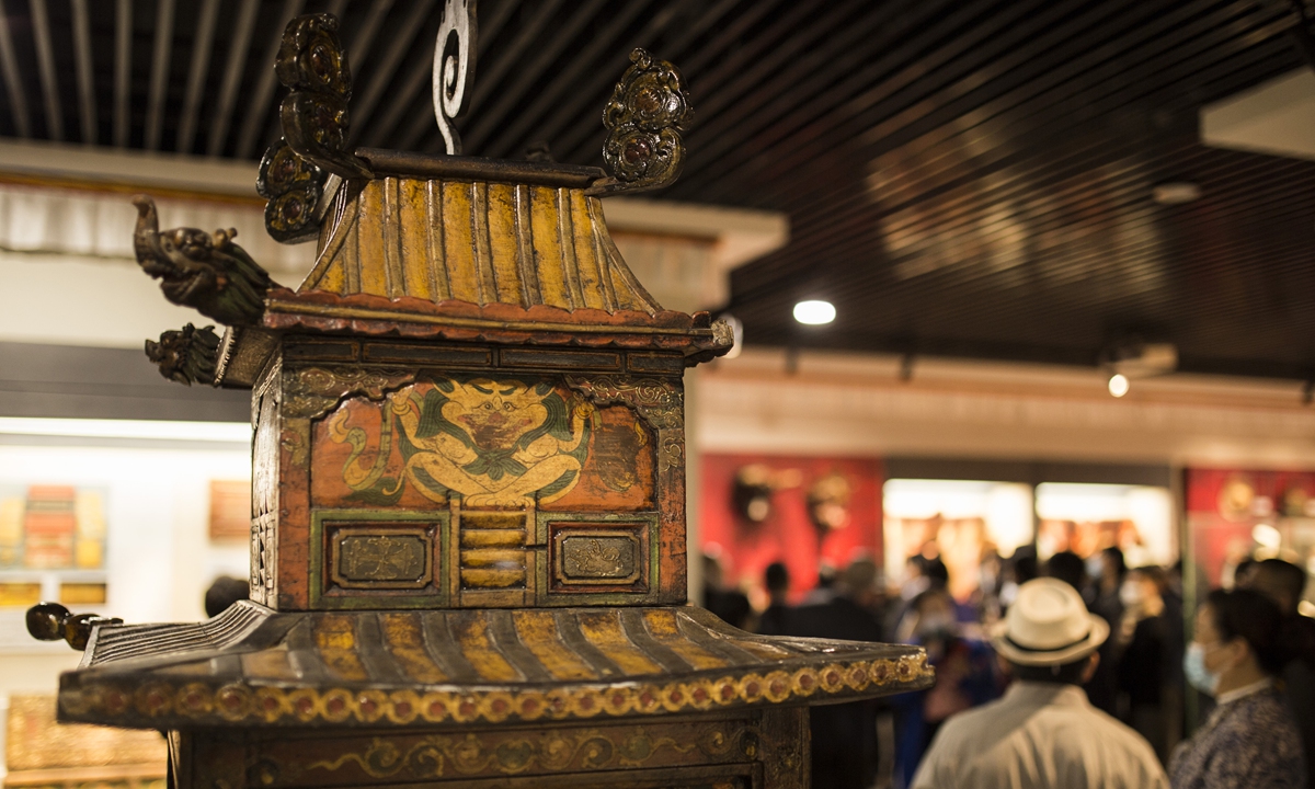 The upper part of a Tibetan Buddhist prayer wheel at the exhibition Photo: Shan Jie/Global Times