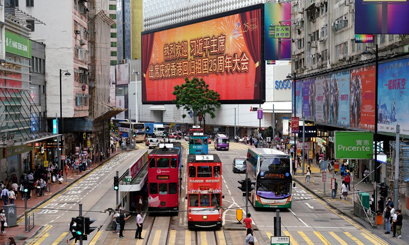A giant screen displayed on the streets of Causeway Bay in Hong Kong shows 