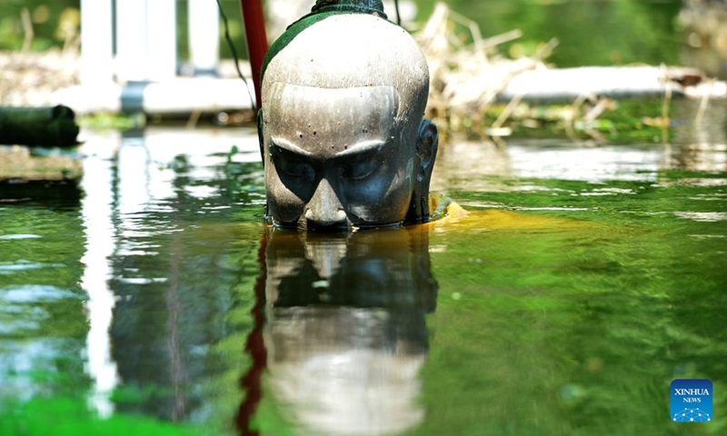 Photo taken on Oct. 18, 2022 shows a sculpture in a flooded area in Ayutthaya, Thailand.(Photo: Xinhua)