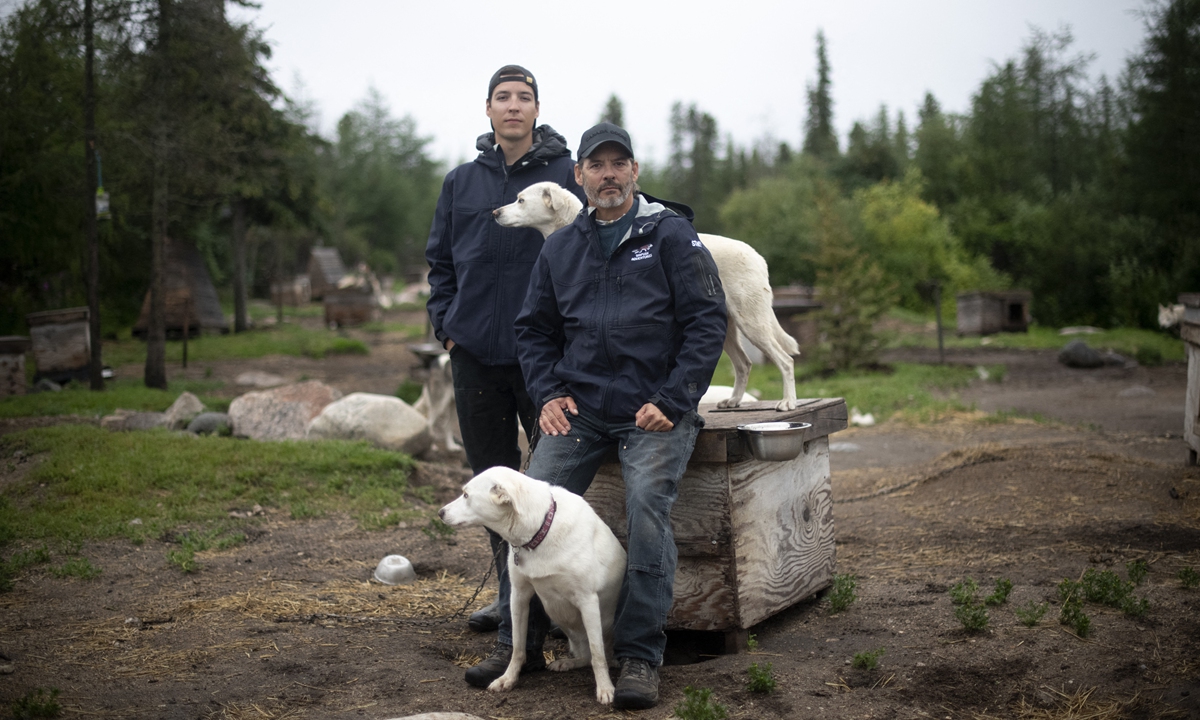Canadian musher David Daley (front), poses with his son Wyatt Daley in Churchill, northern Canada on August 10, 2022. Photo: AFP 