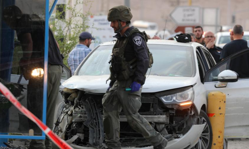 Israeli security forces work at the scene of a car-ramming attack at the Almog Junction near the West Bank city of Jericho, on Oct. 30, 2022. Photo: Xinhua