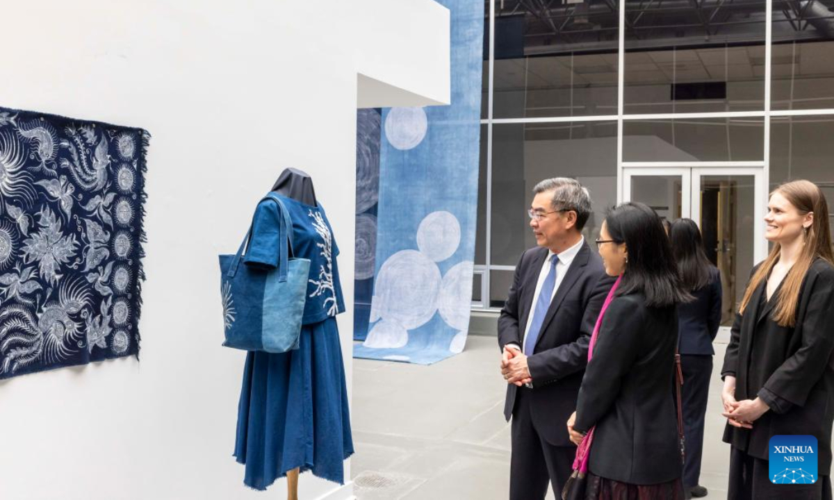 Huang Ping (1st L), the Chinese consul general in New York, views exhibits at an exhibition Textile Arts from Guizhou of China, which is on view during an international symposium Across Time and Space: The Silk Road and the Silk City, at the William Paterson University (WP) in Wayne, New Jersey, the United States, on Oct 26, 2022. Known as US Silk City, Paterson, in the northeastern U.S. state of New Jersey, was considered to be the final stop for China's historic Silk Road that connected civilizations of different parts of the ancient world. Photo:Xinhua