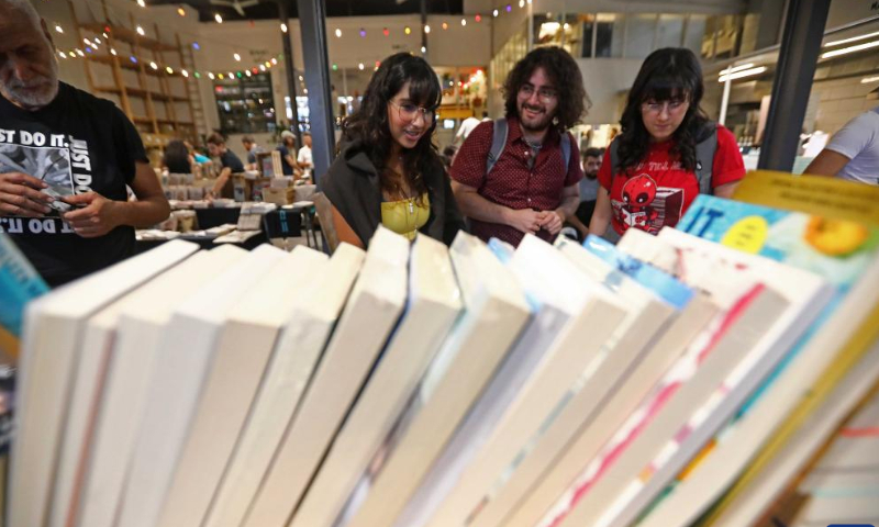 People visit the Book Market in the Mar Mikhael area in Beirut, Lebanon, on Oct. 22, 2022. Photo: Xinhua