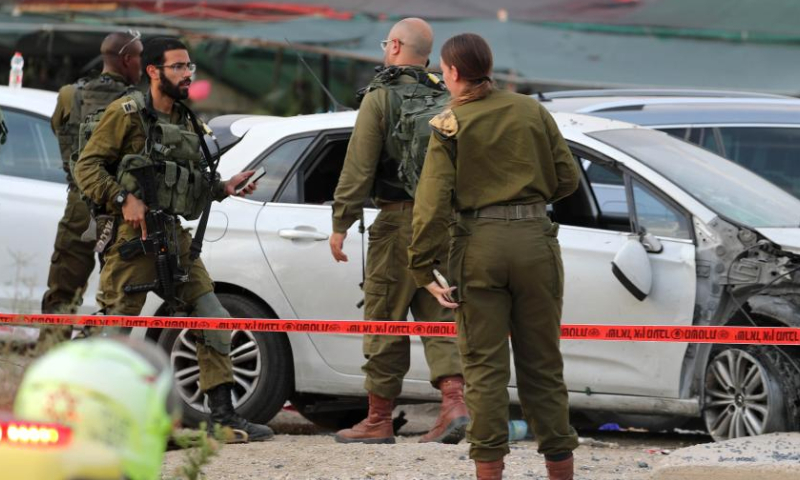 Israeli security forces work at the scene of a car-ramming attack at the Almog Junction near the West Bank city of Jericho, on Oct. 30, 2022. Photo: Xinhua