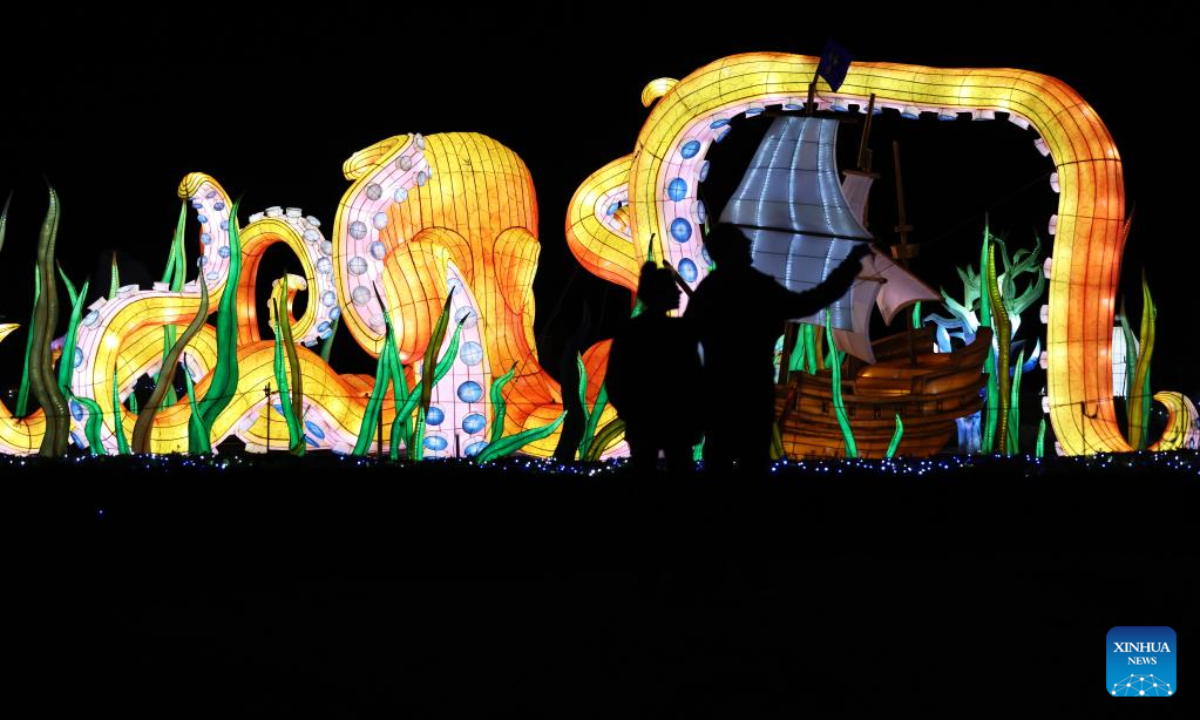 Visitors view illuminated sculptures during a media tour of a light festival at Thoiry zoo near Paris, France, Oct. 26, 2022. The festival will kick off here on Sunday, displaying around 2,000 illuminated sculptures. Photo:Xinhua