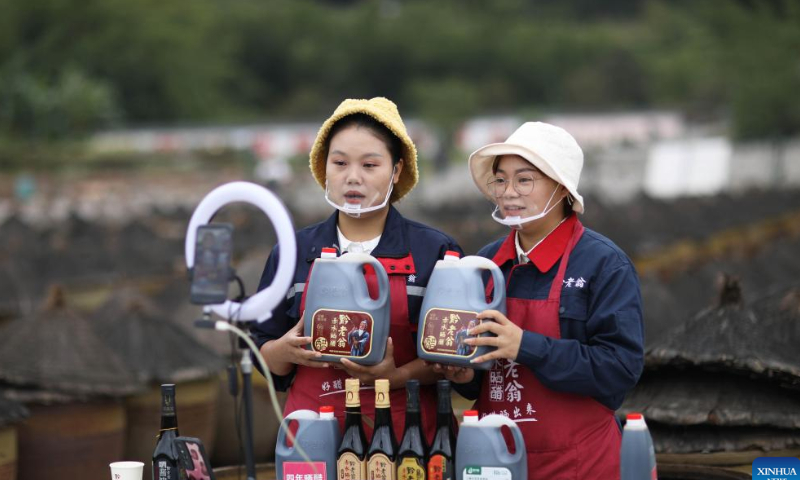 Two women promote vinegar products via livestreaming at a vinegar factory in Chishui, southwest China's Guizhou Province, Oct. 28, 2022.  Photo: Xinhua