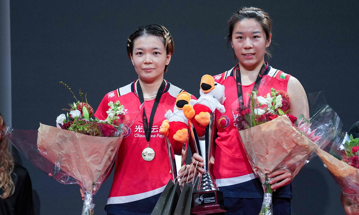 China's Chen Qingchen (left) and Jia Yifan pose on the podium after winning the women's doubles final badminton match of the Denmark Open tournament at Jyske Bank Arena in Odense, Denmark on October 23, 2022. Photo: VCG