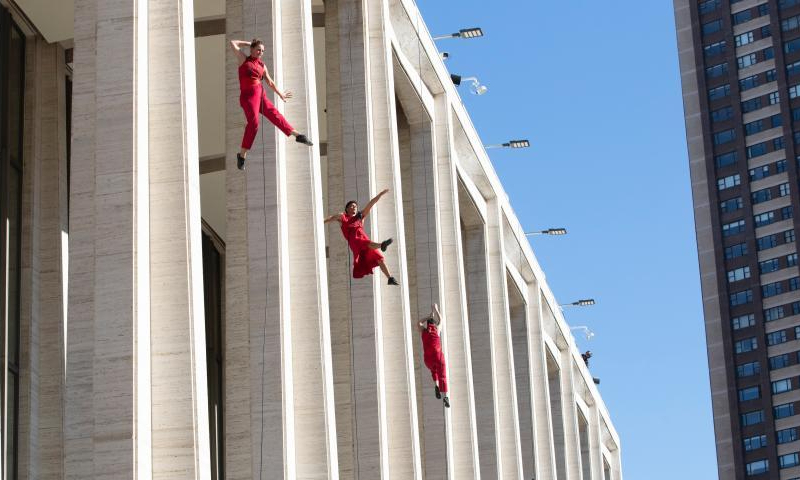 Dancers from Bandaloop perform vertical wall dance on the facade of David Geffen Hall at Lincoln Center during the open house weekend in New York City, New York, the United States, Oct. 29, 2022.  Photo: Xinhua