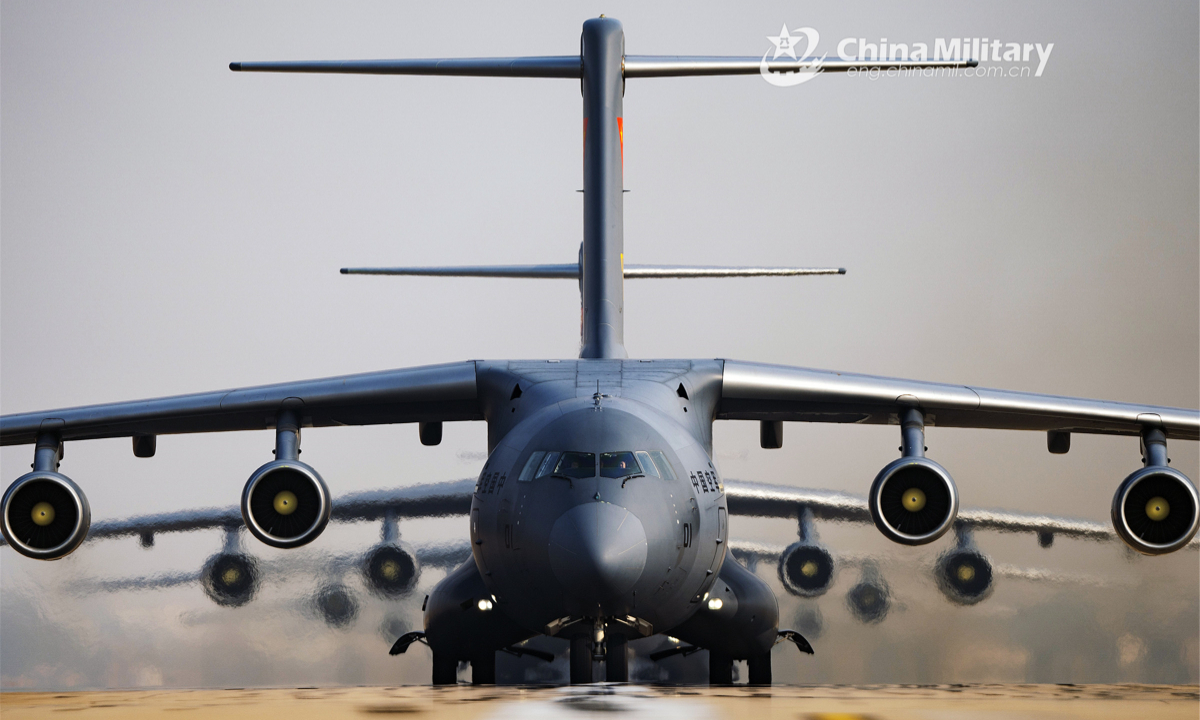 Y-20 transport aircraft participate in a close formation taxi known as elephant walk on the runway. Photo:China Military