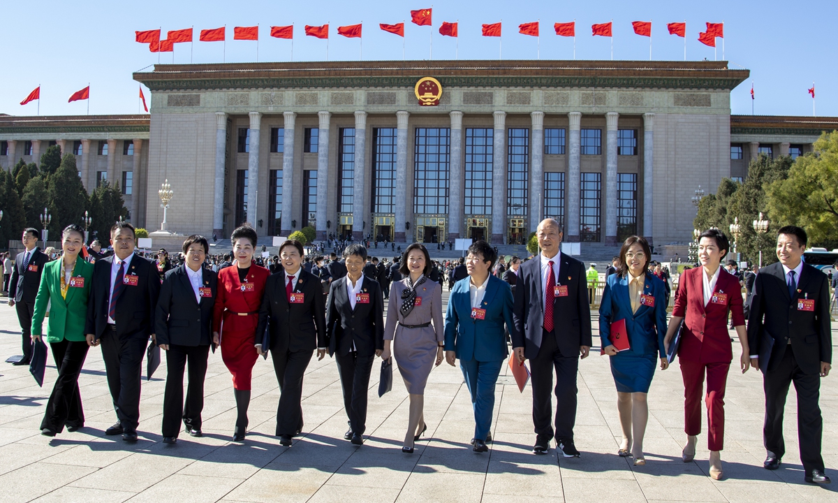 Delegates step out of the Great Hall of the People as the 20th National Congress of the Communist Party of China concludes on October 22, 2022. Photo: VCG