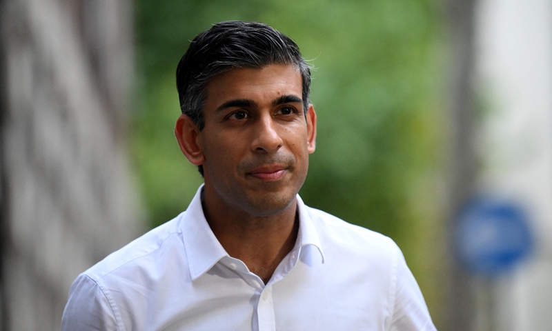 Rishi Sunak leaves from an office in central London on October 23, 2022. Photo: AFP