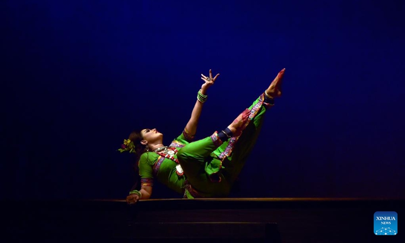 An artist performs on the stage during the drama dance Chandalika in Dhaka, Bangladesh, Oct. 23, 2022. The auditorium of Bangladesh Shilpakala Academy in Dhaka teemed with spectators on Sunday as dance drama based on the popular story Chandalika by 1913 Nobel laureate in literature Rabindranath Tagore was staged as part of an ongoing cultural festival. (Xinhua)