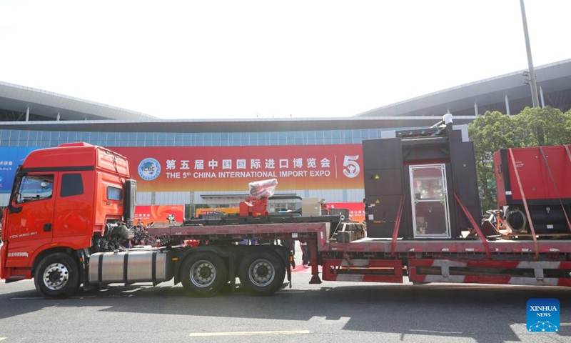 This photo taken on Oct. 24, 2022 shows a truck loaded with the first batch of exhibits arriving at the National Exhibition and Convention Center (Shanghai) in east China's Shanghai. The first batch of eight exhibits from seven exhibitors arrived at the National Exhibition and Convention Center (Shanghai), the main venue for the upcoming fifth China International Import Expo (CIIE), on Monday. (Xinhua/Fang Zhe)
