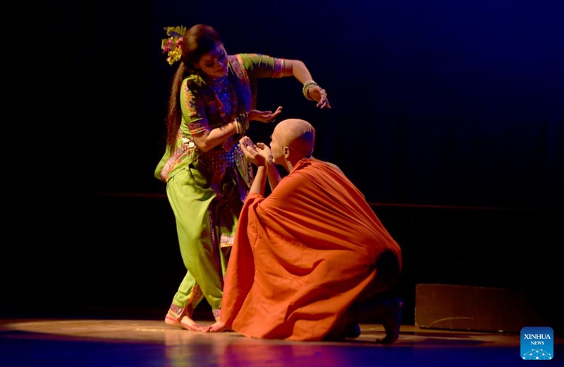 Artists perform on the stage during the drama dance Chandalika in Dhaka, Bangladesh, Oct. 23, 2022. The auditorium of Bangladesh Shilpakala Academy in Dhaka teemed with spectators on Sunday as dance drama based on the popular story Chandalika by 1913 Nobel laureate in literature Rabindranath Tagore was staged as part of an ongoing cultural festival. (Xinhua)
