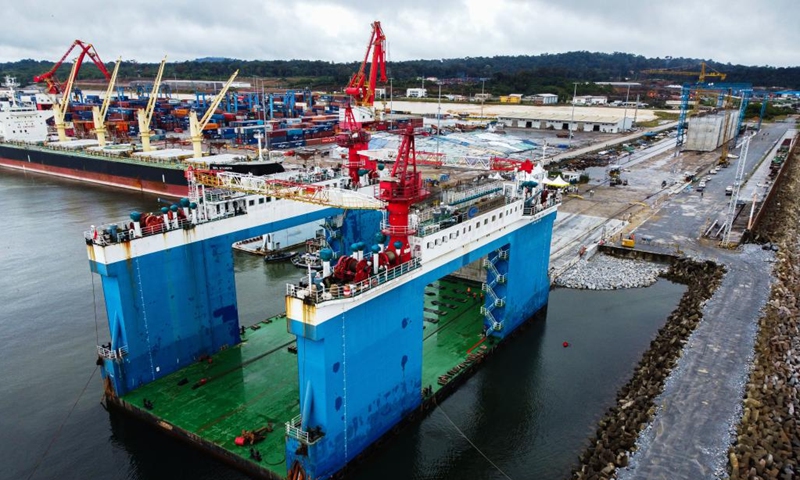 This aerial photo taken on Oct. 22, 2022 shows the caisson for the construction of phase II of Kribi Deep Seaport in Kribi, Cameroon. China Harbour Engineering Company Ltd. (CHEC) has started construction work on the second phase of the Kribi Deep Seaport in southwestern Cameroon with the installation of the first caisson that form the wharves. (Xinhua/Luo Yu)