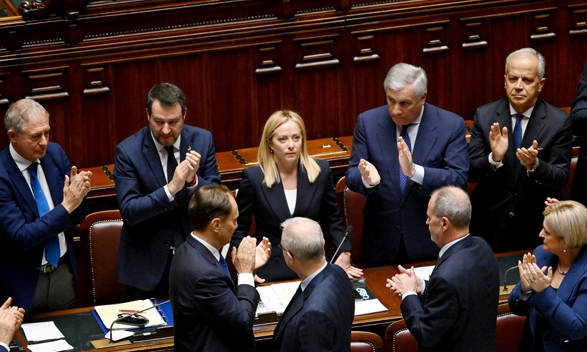 Italy's new Prime Minister Giorgia Meloni (center) is applauded by her cabinet members after her first address to parliament ahead of a confidence vote in Rome on October 25, 2022. The new government faces some of the toughest challenges since World War II and the economy could sink into recession in 2023, Meloni said in her maiden speech to parliament. Photo: AFP