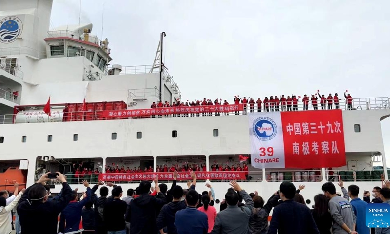 Chinese researchers wave goodbye as the research icebreaker Xuelong 2, or Snow Dragon 2, sets off for the country's 39th Antarctic expedition from Shanghai, east China, Oct. 26, 2022. A total of 255 researchers will carry out investigations in the fields of atmospheric composition, water environment, sedimentary environment and ecosystem at the South Pole, and will arrive in two batches, with the second batch setting out on Oct. 31, 2022.(Photo: Xinhua)