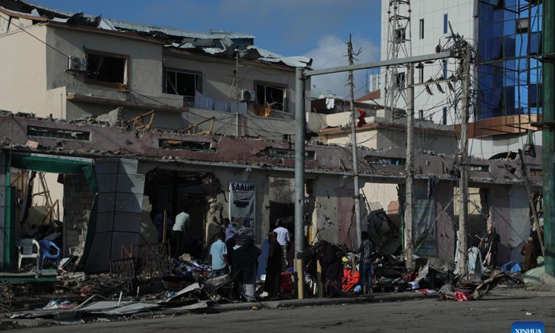 This photo taken on Oct. 30, 2022 shows damaged buildings after car bomb explosions in Mogadishu, capital of Somalia. Twin car bomb explosions targeting Somalia's Education Ministry building here on Saturday killed at least 100 people and injured more than 300 others, Somali President Hassan Sheikh Mohamud said Sunday. (Photo by Hassan Bashi/Xinhua)