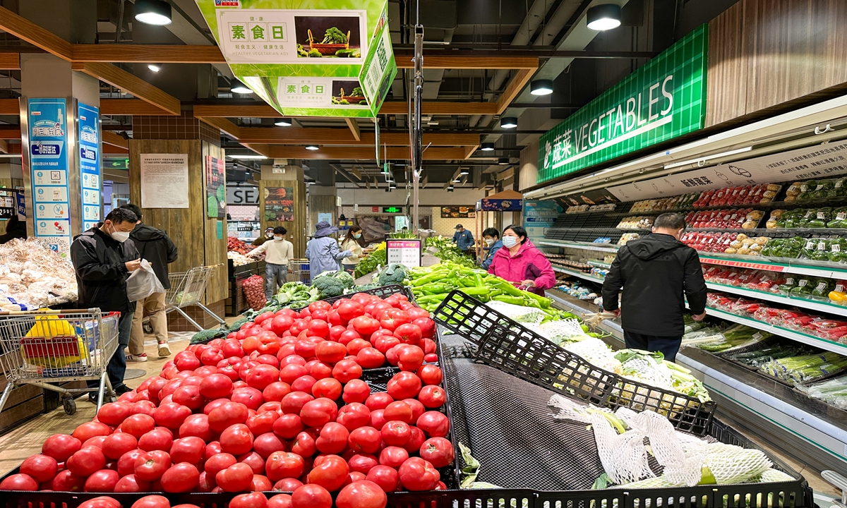 Residents in Zhengzhou, Central China's Henan Province purchase daily commodities at a supermarket on Tuesday. Photo: VCG