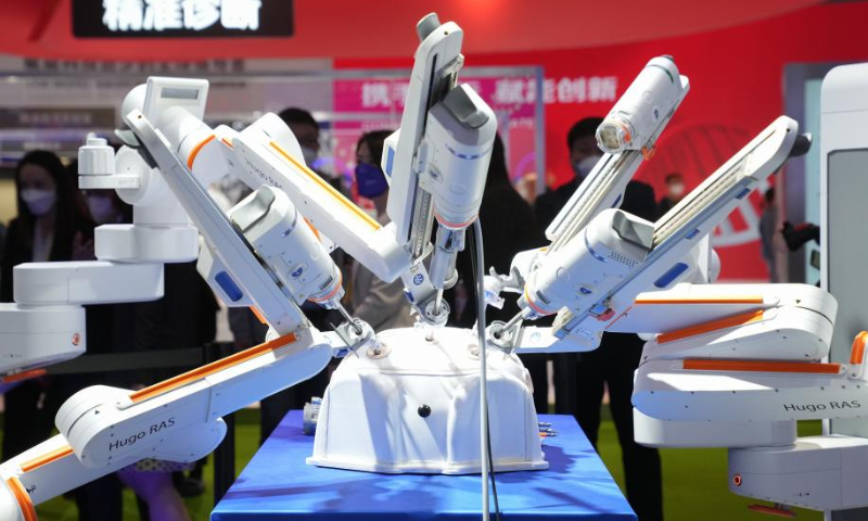 This photo taken on Nov. 6, 2022 shows a surgical robot exhibited at the Medtronic booth in the medical equipment and healthcare products exhibition area of the fifth China International Import Expo (CIIE) at the National Exhibition and Convention Center (Shanghai) in east China's Shanghai. Photo: Xinhua