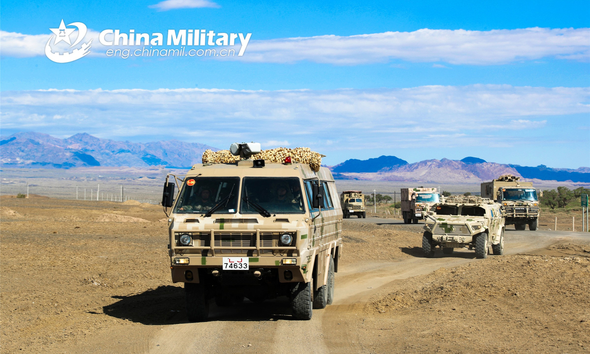 Military trucks attached to a PLA border defense regiment pass through a simulated chemical-weapon-struck area during a long-distance maneuver in a comprehensive exercise held on September 26, 2022. Photo:China Military
