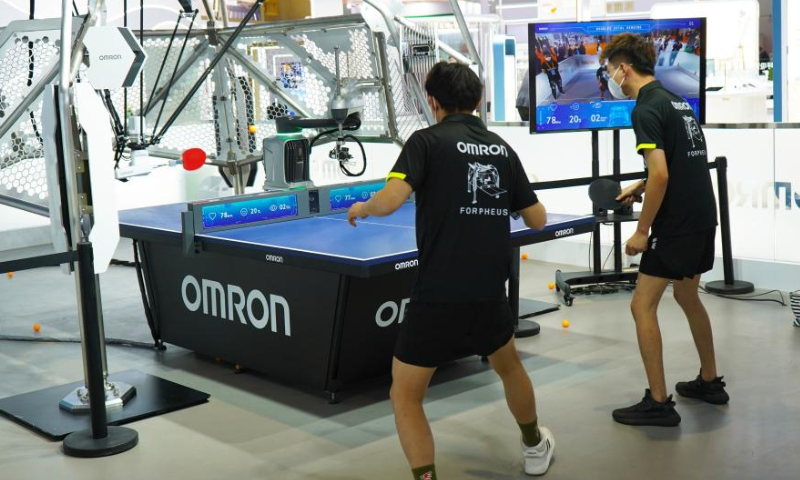 A robot which can serve ping pong balls is seen at the booth of Omron at the Intelligent Industry and Information Technology exhibition area of the fifth China International Import Expo (CIIE) at the National Exhibition and Convention Center (Shanghai) in east China's Shanghai, Nov. 5, 2022. The fifth CIIE is scheduled on Nov. 5-10 in China's economic hub Shanghai. Photo: Xinhua