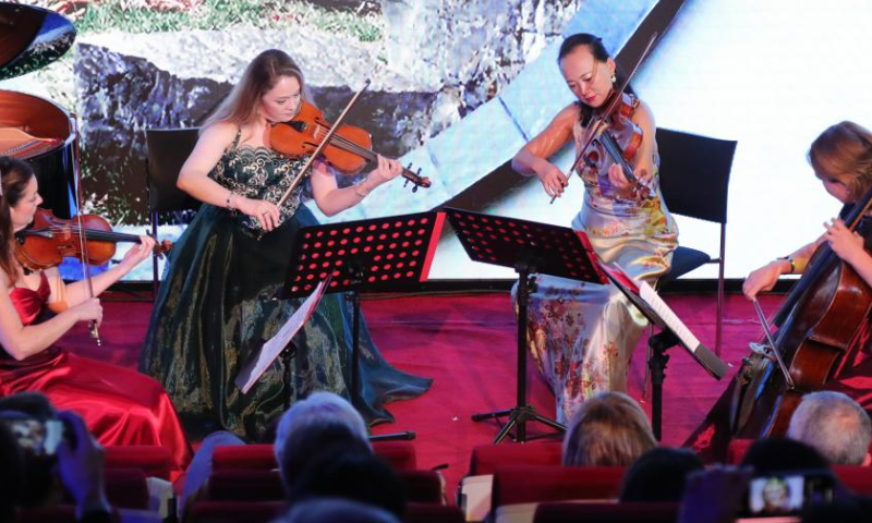 Artists of a string quartet perform during a chamber concert titled Melody of the Orient in Brussels, Belgium, Oct. 29, 2022. (Xinhua/Zheng Huansong)