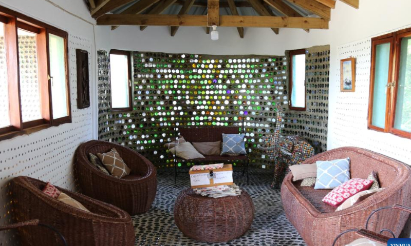 This photo taken on Nov. 5, 2022 shows the living room of a house built with recycled glass bottles in Macaneta, Mozambique. Macaneta, an underdeveloped beach resort located on the northern outskirts of Mozambique's capital Maputo, may be less known to foreign visitors. However, one new project has recently been added to the resort's few attractions: a house built with recycled glass bottles. Photo: Xinhua