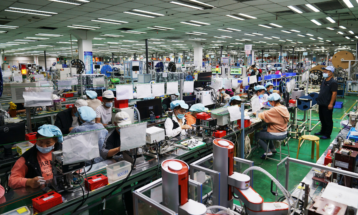 Workers at a production workshop of Foxconn's technology park in Zhengzhou, Central China's Henan Province on September 4, 2021. The park is a major global smartphone manufacturing base. Photo: VCG