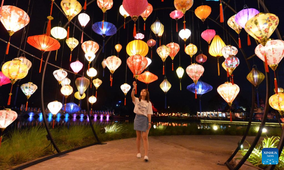 A woman visits the Thailand International Lantern and Food Festival in Muangboran of Samut Prakan Province, Thailand, Nov 4, 2022. Photo:Xinhua