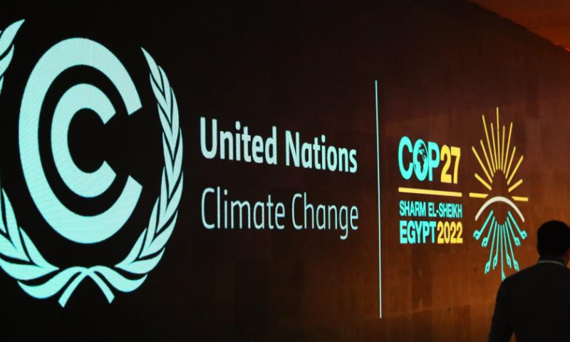 A man walks past a board showing the 27th Conference of the Parties of the United Nations Framework Convention on Climate Change (COP27) in Sharm El-Sheikh, Egypt, Nov. 5, 2022. The COP27 is to be held from Nov. 6 to18 in Egypt's resort city of Sharm El-Sheikh. Photo: Xinhua