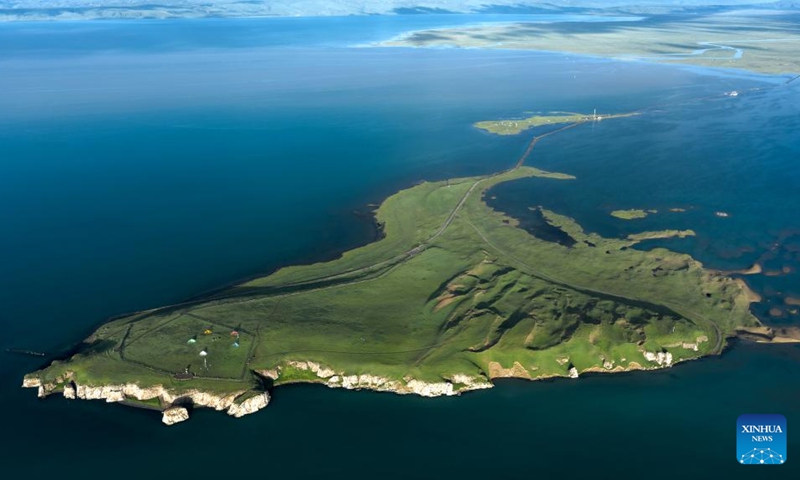This aerial photo taken on July 17, 2020 shows a view of the Bird Island wetland at Qinghai Lake in northwest China's Qinghai Province. Qinghai Lake, located in northwest China's Qinghai Province, is China's largest inland saltwater lake. It is a major transit point for migratory birds from Central Asia to India and East Asia to Australia. It also serves as an important winter home for waterbirds on the Qinghai-Tibet Plateau.(Photo: Xinhua)