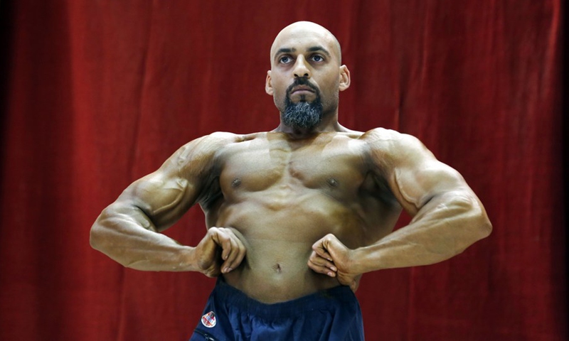 An athlete competes in a bodybuilding game in Sanaa, Yemen's capital, on Oct. 20, 2022.(Photo: Xinhua)