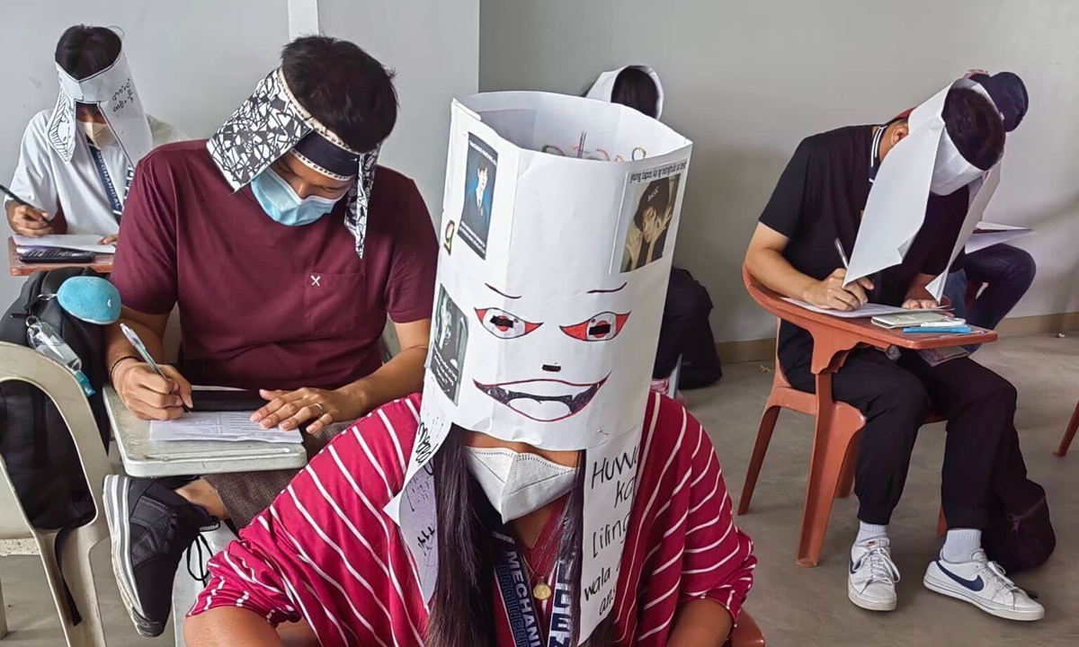 Students at one college in Legazpi City were asked to wear headgear that would prevent them from peeking at others' papers. Photo: NBC News