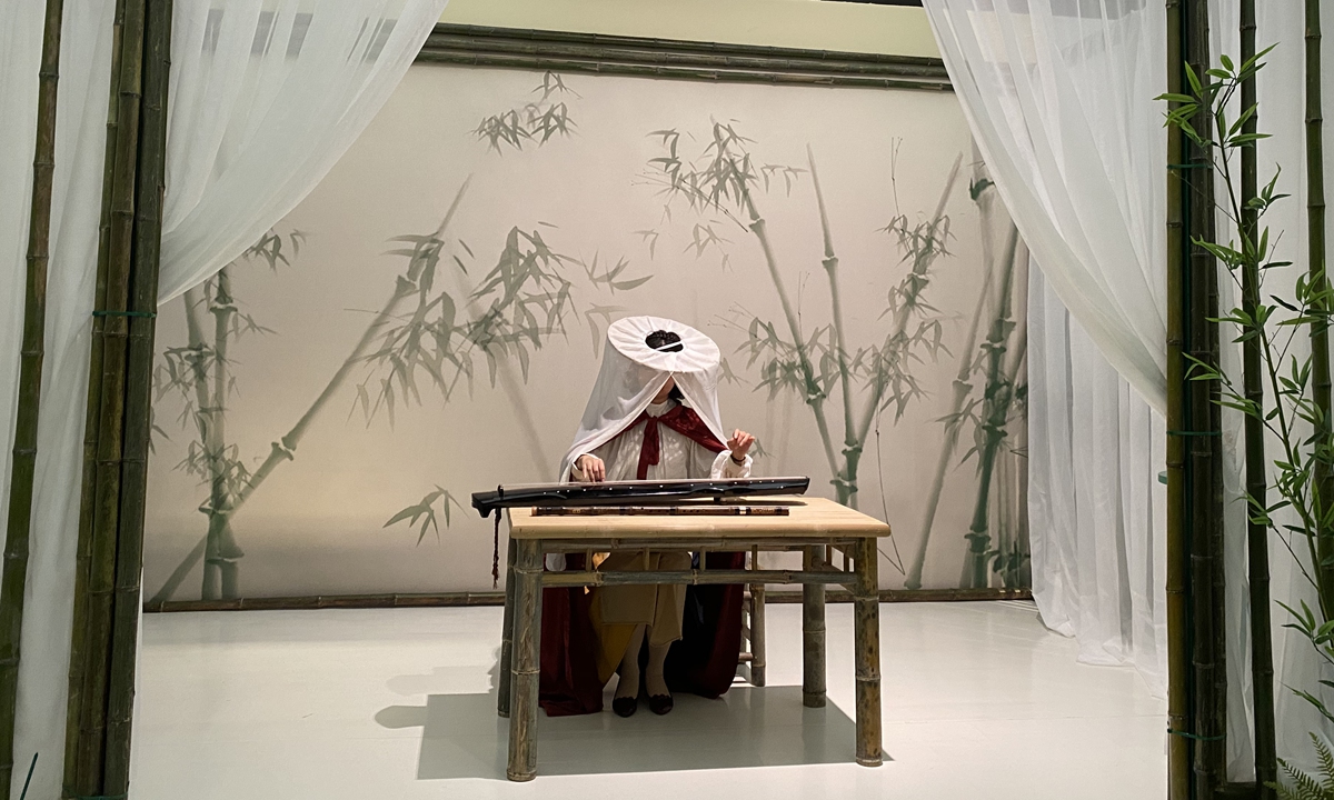 A visitor is dressed up for a photo at the Jin Yong Exhibition in Shanghai on November 1, 2022. 
Photo: Xie Jun/Global Times Copies of Louis Cha's Ode to Gallantry Photo: IC