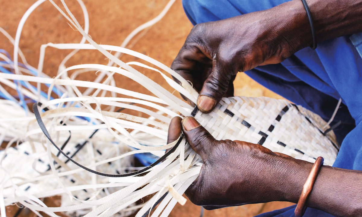 A basket made from plastic in the process of being woven Photo: VCG