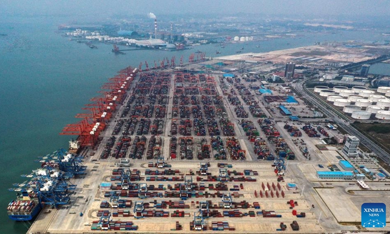 This aerial photo taken on Nov. 3, 2022 shows a view of Qinzhou Port in Qinzhou, south China's Guangxi Zhuang Autonomous Region. In the first ten months of this year, the New International Land-Sea Trade Corridor saw 621,026 TEU containers transported by the railway intermodal freight trains, up 19.7 percent year on year.(Photo: Xinhua)