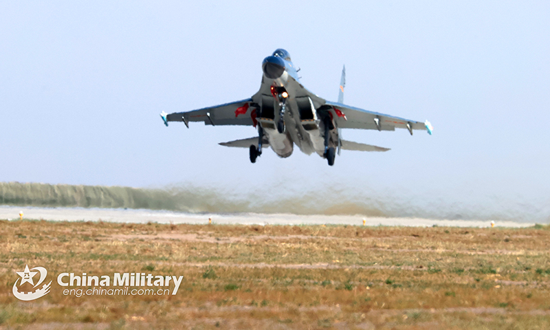 A fighter jet attached to an aviation brigade of the PLA Air Force takes off for a flight training exercise on September 29, 2022. (eng.chinamil.com.cn/Photo by Cui Baoliang) 
