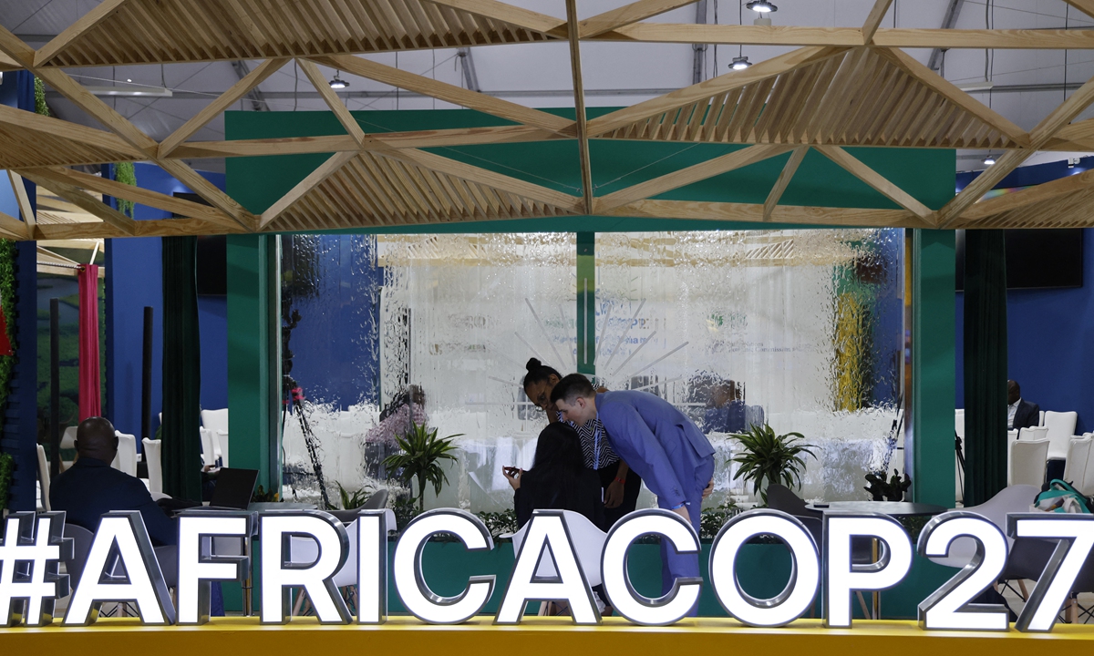 Participants and delegates work in the Africa pavillon at the Sharm El Sheikh International Convention Centre, on the first day of the COP27 climate summit, in Egypt's Red Sea resort city of Sharm el-Sheikh, on November 6, 2022. Photo: AFP