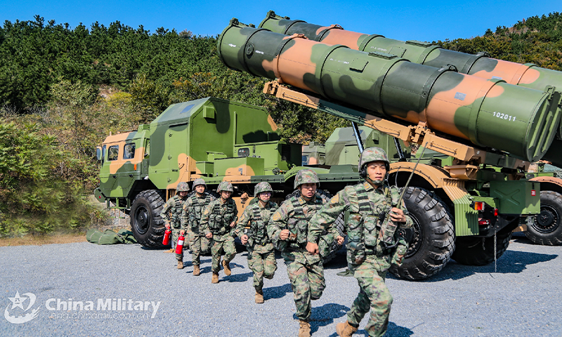 Soldier assigned to a coastal missile regiment with the navy under the PLA Northern Theater Command rush to their positions during a land-to-sea training exercise on October 11, 2022. (eng.chinamil.com.cn/Photo by Liu Zihao)