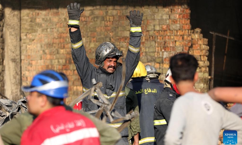 Rescuers work at the site of a building fire in central Baghdad, Iraq, on Nov. 7, 2022. Iraqi rescue teams on Monday continue to search for the 11 missing people believed to have been buried in the rubbles of a building that was engulfed by a massive fire on Sunday in central Baghdad.(Photo: Xinhua)