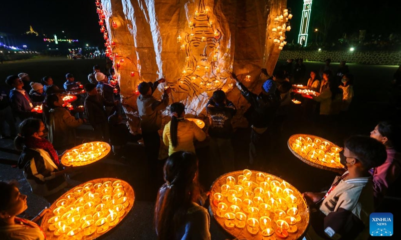 People attach small lanterns to a hot air balloon during the Tazaungdaing festival in Pyin Oo Lwin, Myanmar, November 6, 2022. Myanmar held a five-day hot air balloon festival in Pyin Oo Lwin from Friday after a two-year break due to the COVID-19 pandemic.  (Photo: Xinhua)