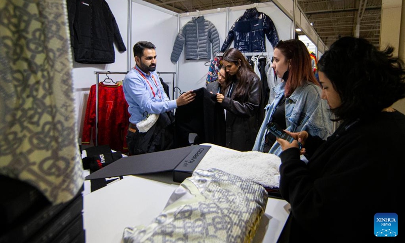 People attend the 2022 Apparel Textile Sourcing Trade Show in Toronto, Canada, on Nov. 7, 2022. As the largest apparel and textile sourcing event in Canada, the three-day event kicked off here on Monday.(Photo: Xinhua)