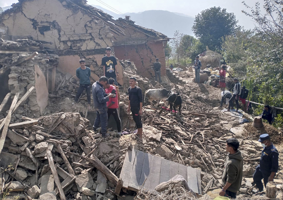 Nepalese villagers stand amid the debris of their mudhouses after an earthquake in Doti district, Nepal, on November 9, 2022. A government official said the quake has killed at least six people while they were asleep in their houses in a remote, sparsely populated mountain village. Photo: VCG