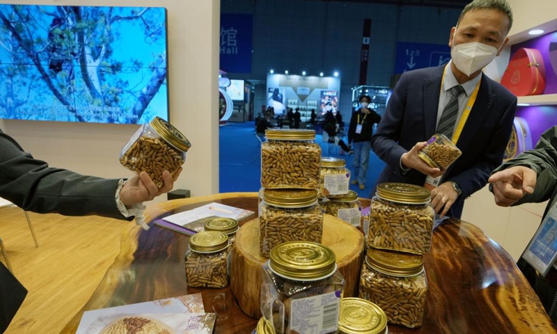 This photo taken on Nov. 5, 2022 shows Afghan pine nuts during the fifth China International Import Expo (CIIE) in east China's Shanghai. Various foods from around the world are showcased at the food and agricultural products exhibition area during the fifth CIIE in Shanghai.(Photo: Xinhua)